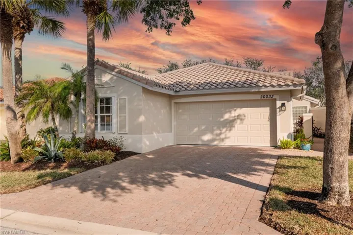 Mediterranean / spanish-style home featuring a garage