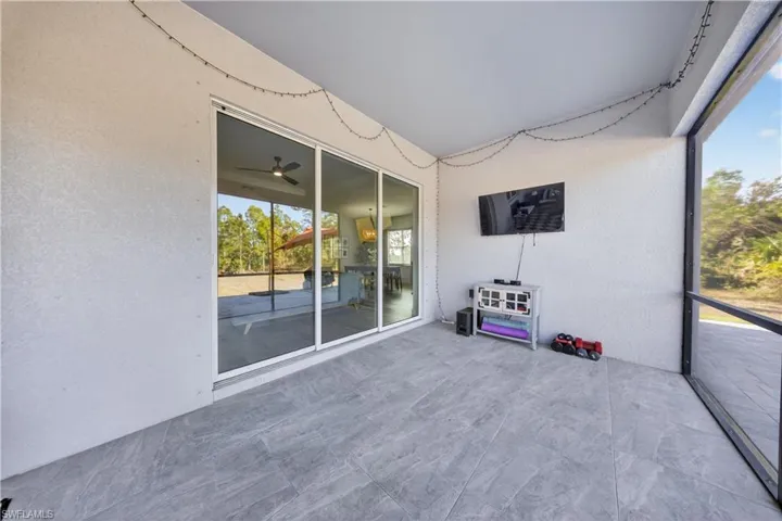 Unfurnished sunroom with a ceiling fan