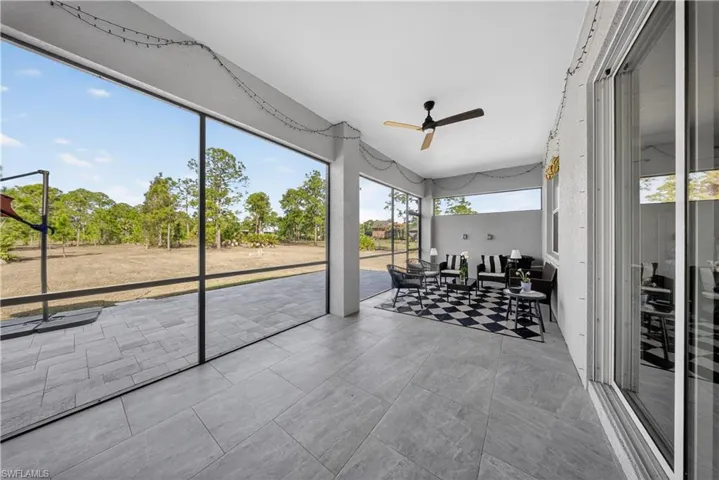 Sunroom / solarium with a ceiling fan