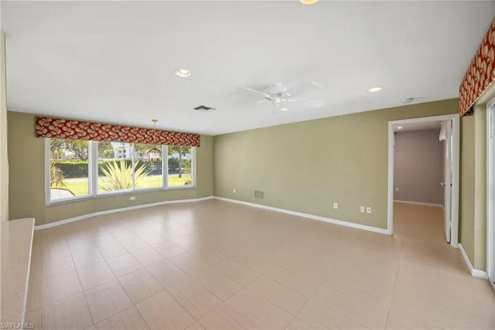 Spare room featuring recessed lighting, light tile patterned floors, and ceiling fan