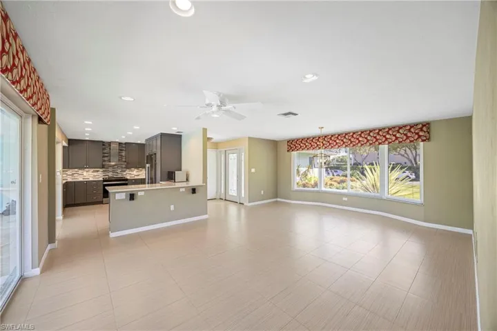 Unfurnished living room featuring recessed lighting, ceiling fan, and light tile patterned flooring