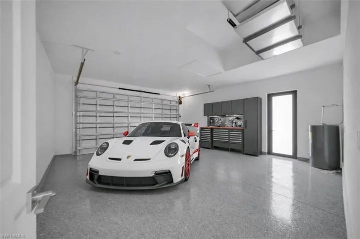 Garage featuring water heater