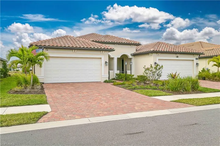 Mediterranean / spanish home with a garage