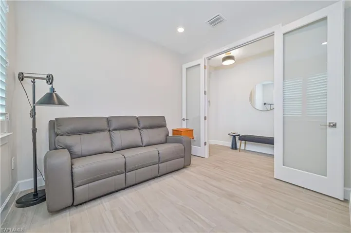 Living room with light wood-type flooring