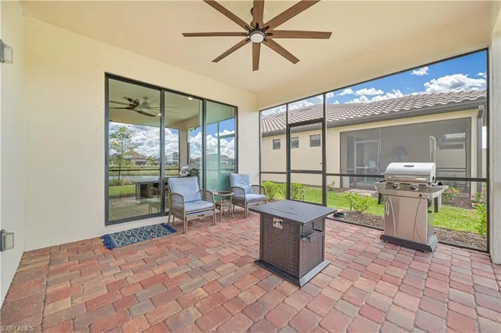 Sunroom / solarium featuring ceiling fan