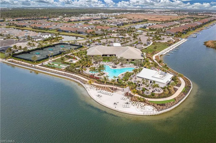Birds eye view of property with a water view