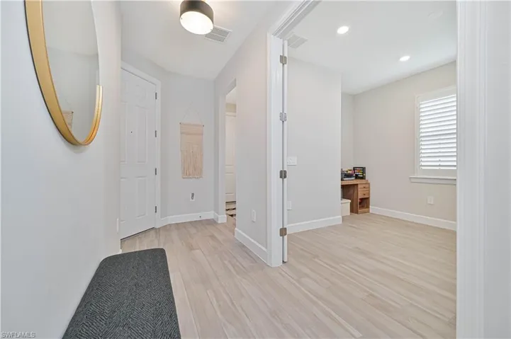 Hallway featuring light hardwood / wood-style flooring