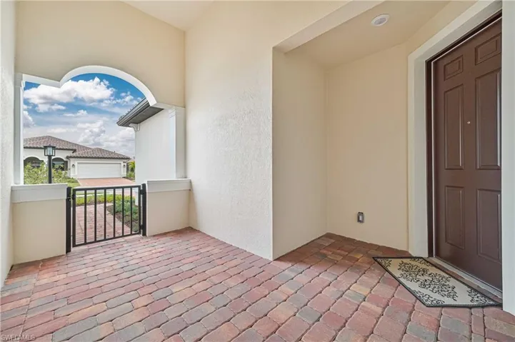 Doorway to property with a balcony