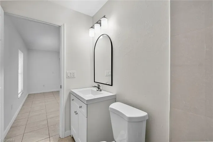 Bathroom featuring vanity and light tile patterned floors