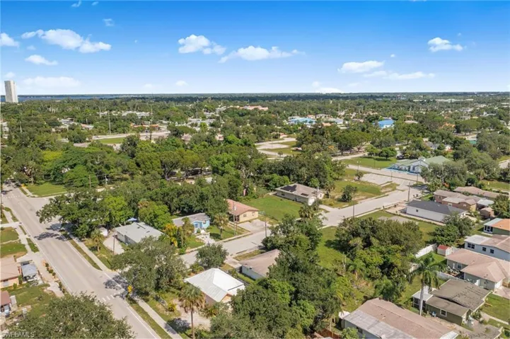 Aerial view of residential area with a tree filled landscape