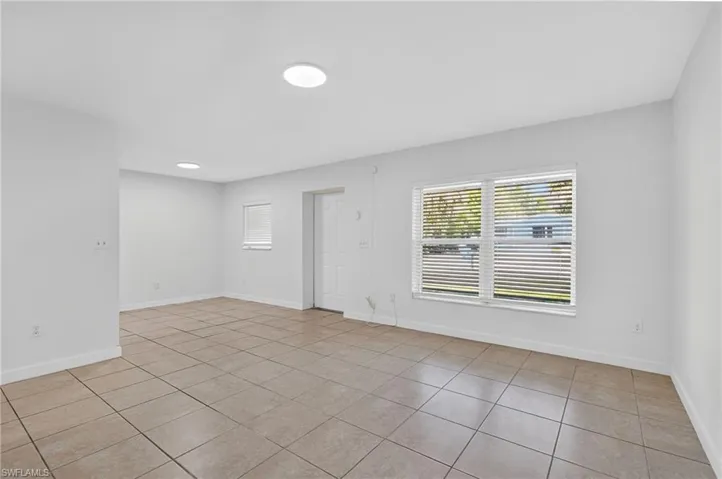 Spare room featuring light tile patterned floors