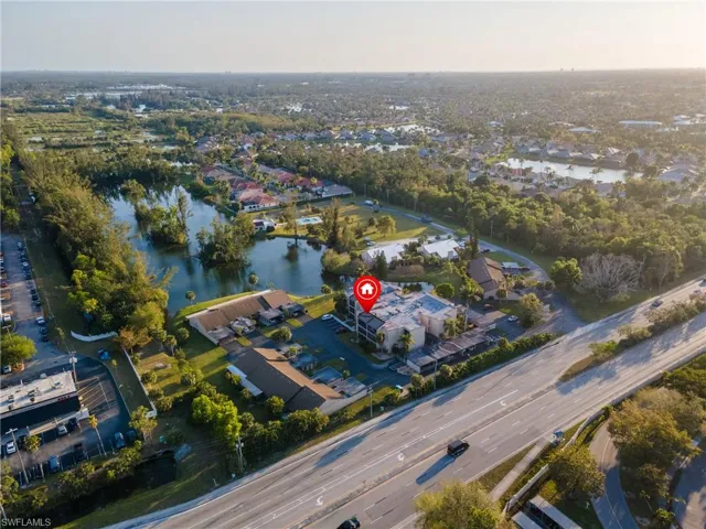 Birds eye view of property featuring a water view