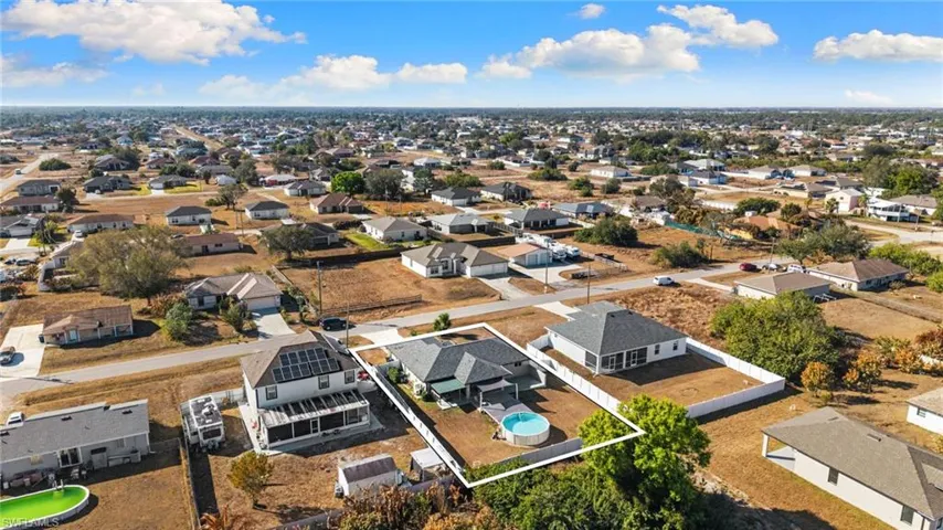 Aerial view of property's location featuring nearby suburban area and property boundaries highlighted