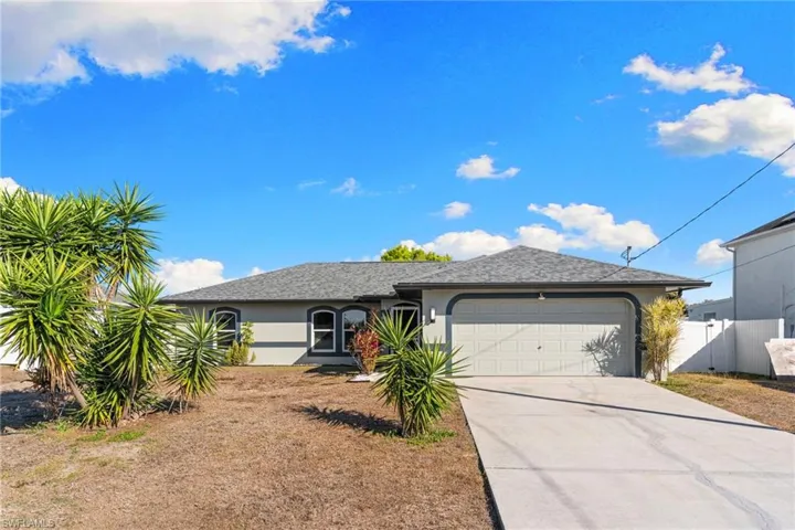 Single story home with attached garage.