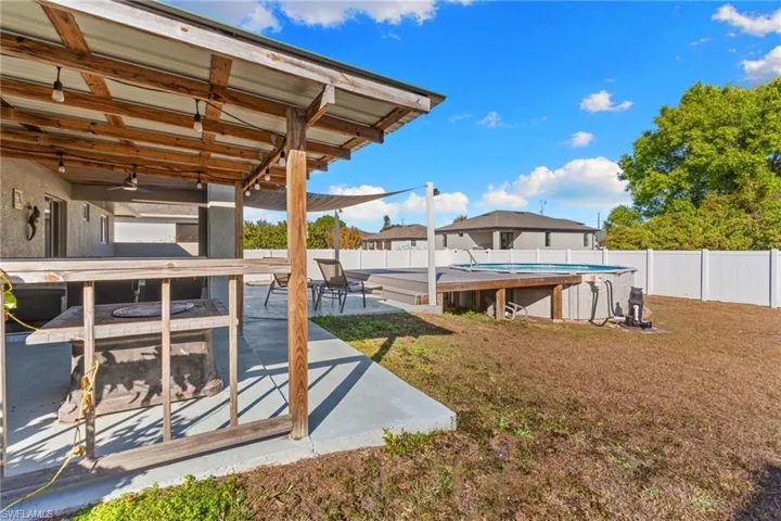 BBQ area and backyard view.