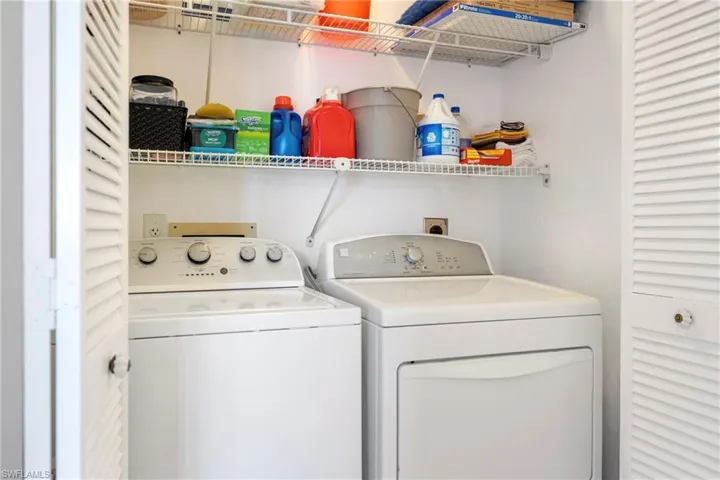 Laundry area featuring washing machine and clothes dryer