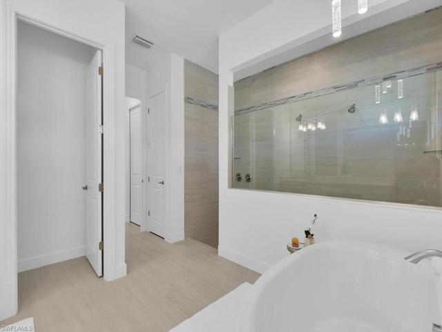 Master Bath-Dual Shower Heads & Tile Extended to the Ceiling!