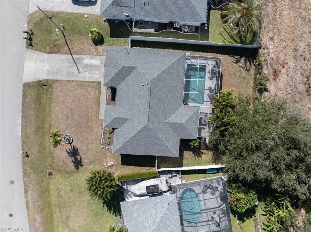 View of subject property with a pool