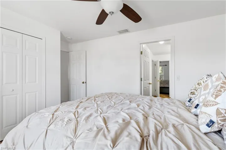 Bedroom featuring a closet and a ceiling fan