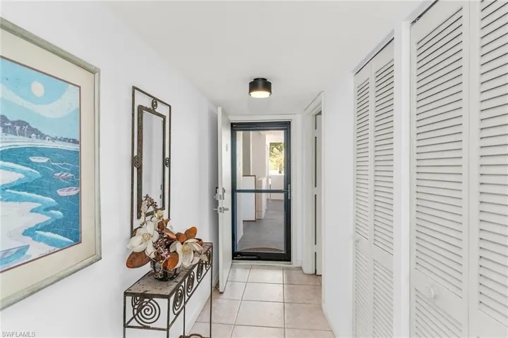 Hall with light tile patterned floors