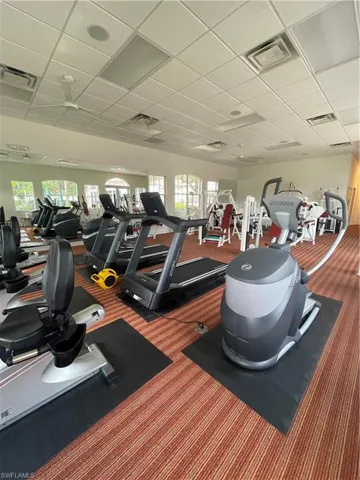 Gym with a paneled ceiling