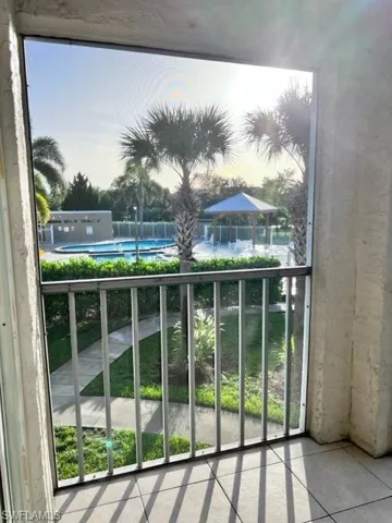 Balcony with view of pool area
