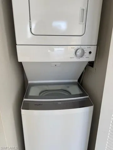 Washroom with stacked washer / dryer