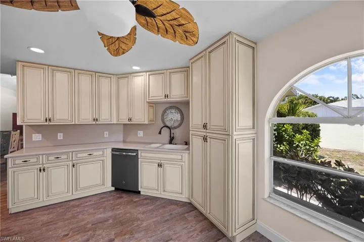 Kitchen with lots of cabinets and storage, and ceiling fan