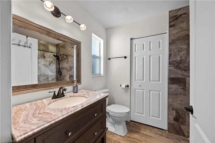 Master Bathroom with nice vanity and another large walk in closet & shower