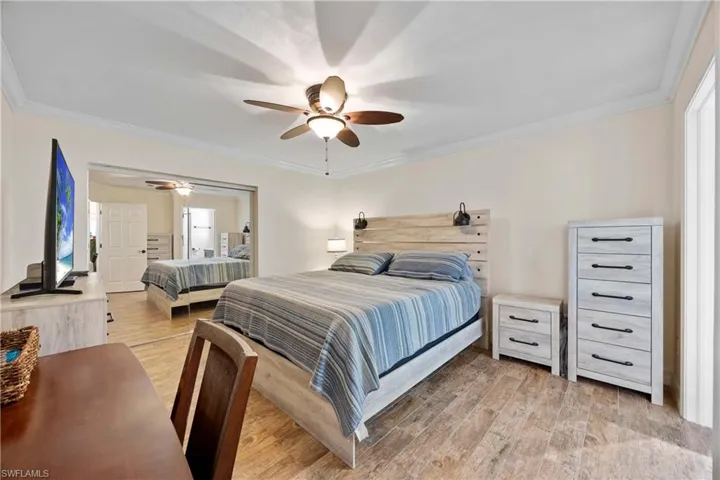 Master Bedroom with mirrored doors that lead to a huge walk in closet