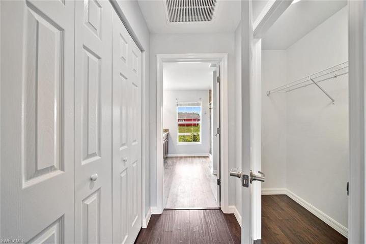 Master bedroom hallway closets on each side leading to the bathroom