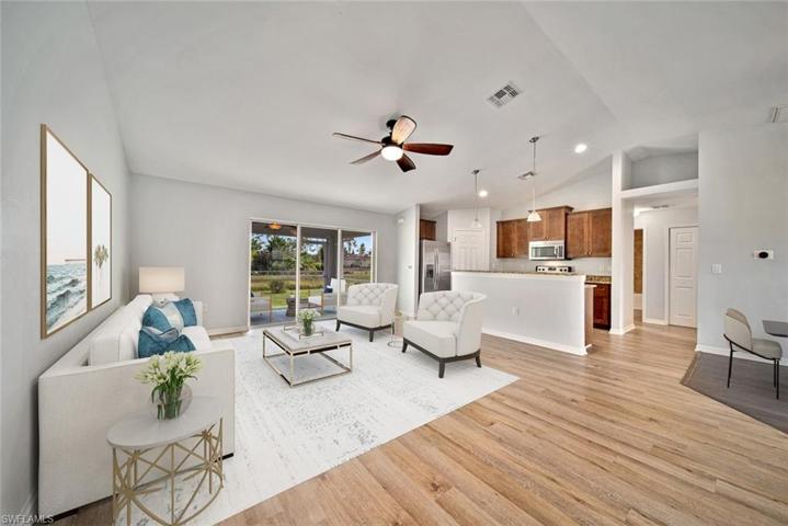 Open Great Room floor plan with split bedrooms, 2 full baths, screened lanai and 2 car garage.