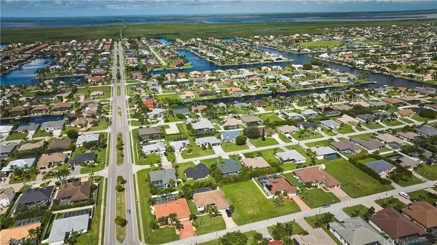 View of property location with nearby suburban area