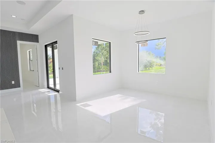 Unfurnished room featuring light tile patterned flooring and recessed lighting