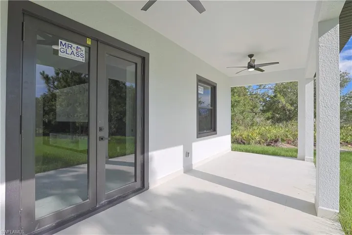View of patio featuring ceiling fan