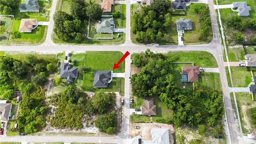 Aerial overview of property's location featuring nearby suburban area