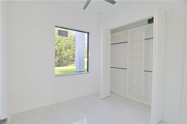 Unfurnished bedroom with a closet and ceiling fan