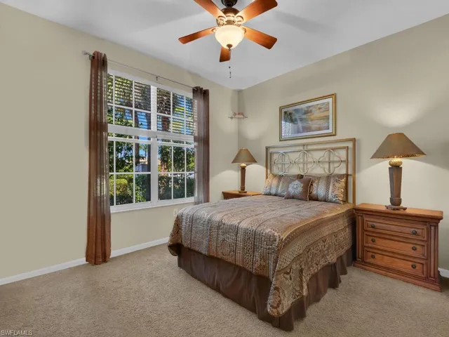 Large guest room with carpeting and walk in closet