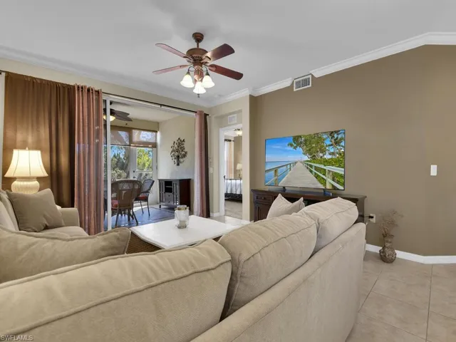 Living room open open to solarium and water view