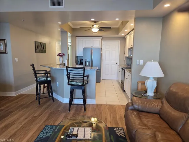 Open concept living area with wood-finish flooring