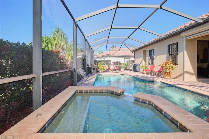 View of swimming pool featuring spa waterfall ino pool