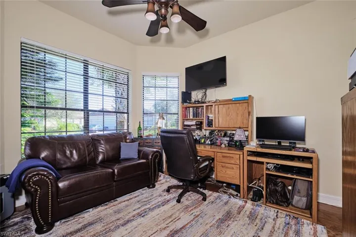 Office area featuring ceiling fan and hardwood / wood-style flooring