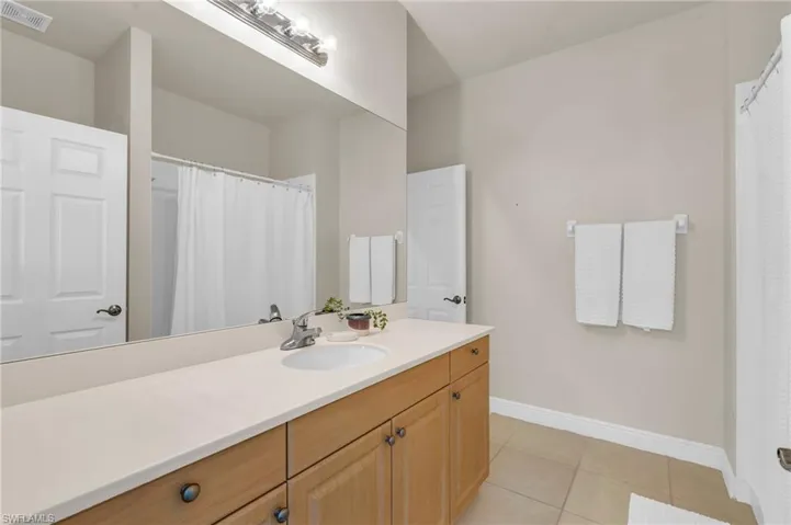 Bathroom featuring vanity and tile patterned floors