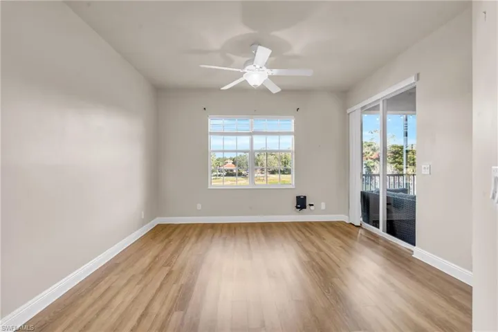 Bedroom featuring ceiling fan, plenty of natural light, and light  wood-style floors