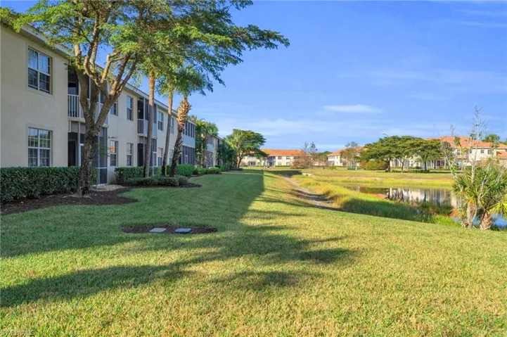 View of back yard featuring a water view