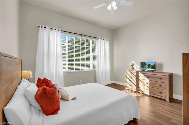 Bedroom featuring wood-style flooring and ceiling fan