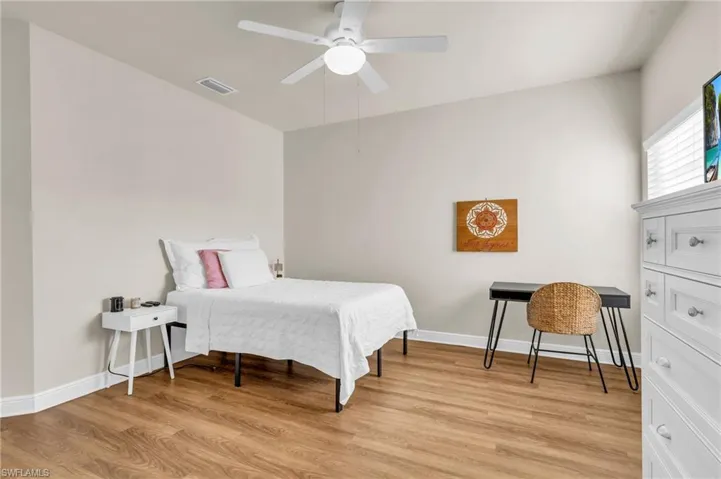 Bedroom featuring ceiling fan and light wood-style floors