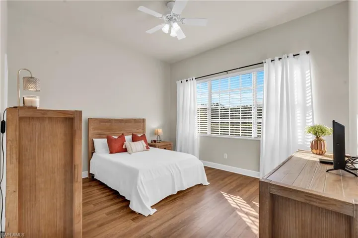Bedroom featuring wood-style flooring and ceiling fan