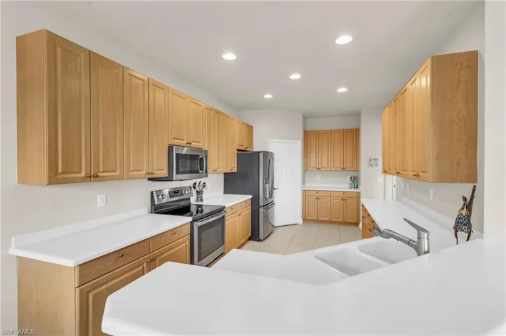 Kitchen featuring cabinets, and appliances with stainless steel finishes