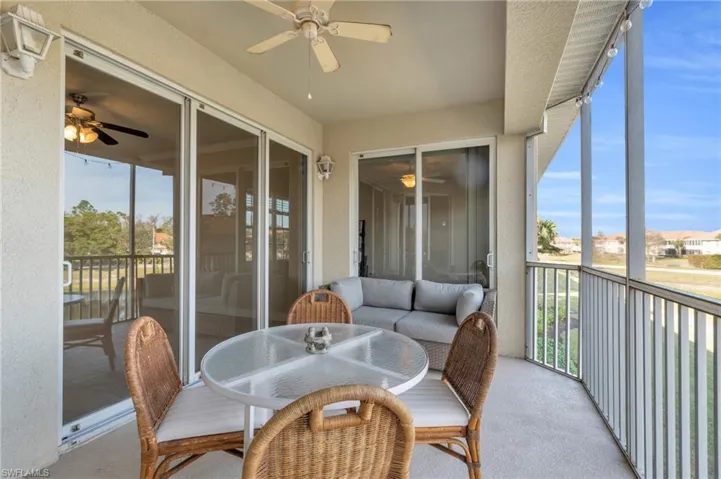 Screened in lanai featuring plenty of natural light and ceiling fan